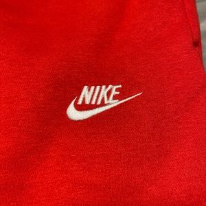 Red Nike men’s sweatpants NWT.  Standard fit. Taper leg.  Size medium